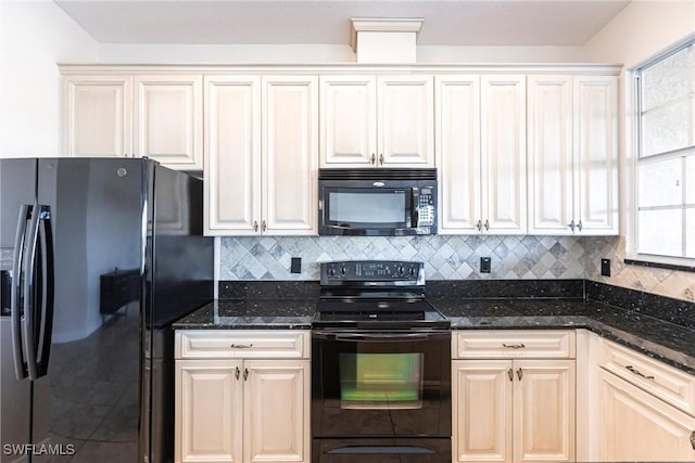 kitchen featuring black appliances, backsplash, and dark stone counters