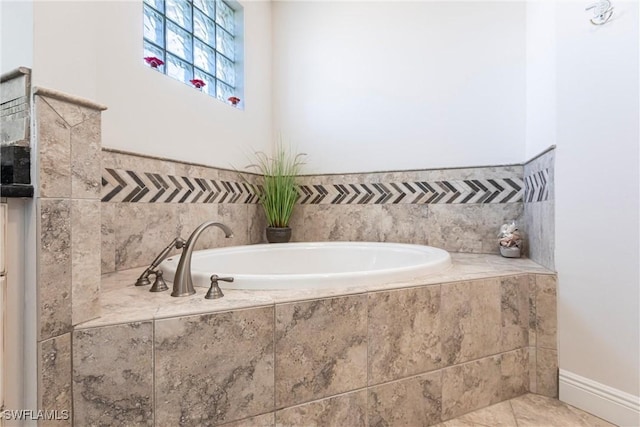 full bath with tile patterned flooring and a garden tub