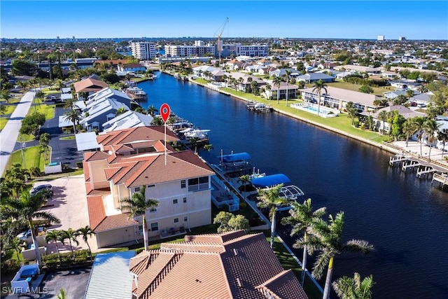 birds eye view of property with a residential view and a water view