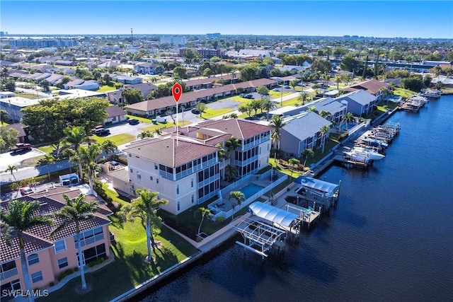 birds eye view of property with a residential view and a water view