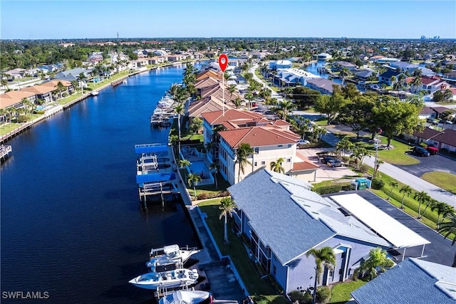 bird's eye view featuring a residential view and a water view