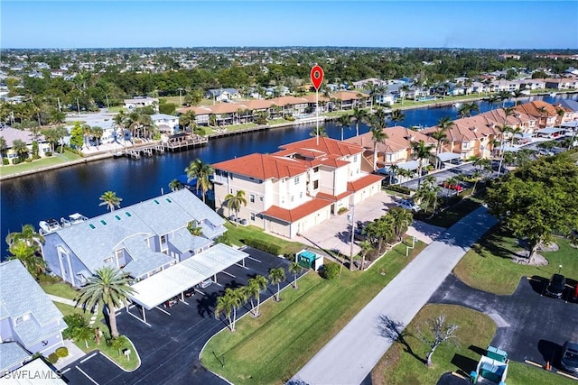 bird's eye view featuring a residential view and a water view