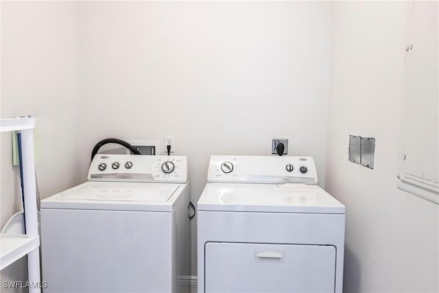 washroom with washer and dryer and laundry area