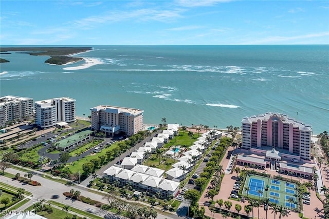 birds eye view of property featuring a water view and a city view