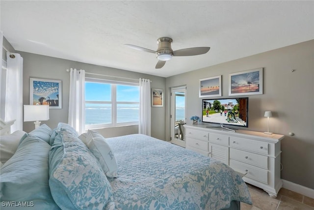 bedroom featuring a ceiling fan and baseboards