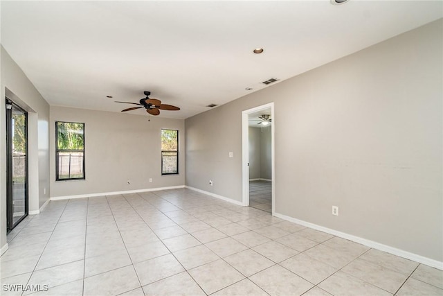 spare room featuring light tile patterned floors, baseboards, visible vents, recessed lighting, and ceiling fan