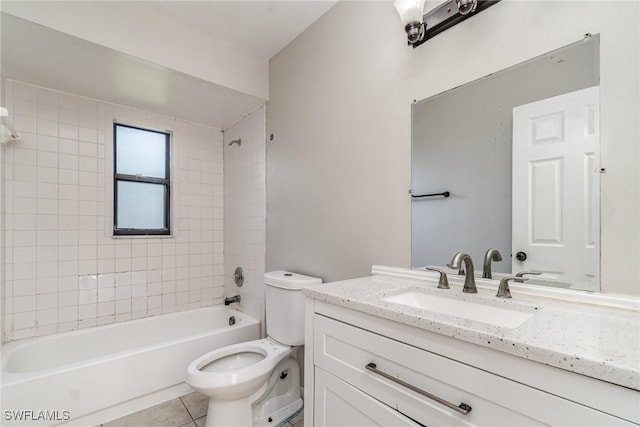 full bathroom with washtub / shower combination, toilet, vanity, and tile patterned flooring