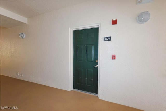 view of exterior entry featuring stucco siding