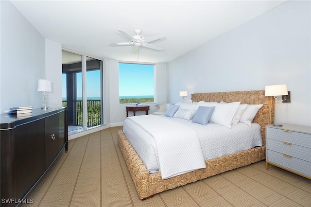 bedroom featuring access to outside and a ceiling fan