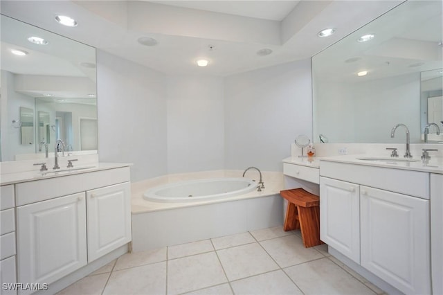 bathroom with a sink, two vanities, and tile patterned floors