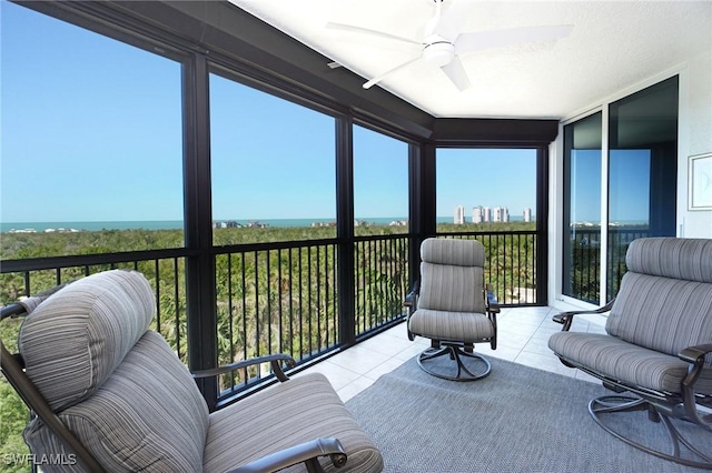 sunroom featuring ceiling fan