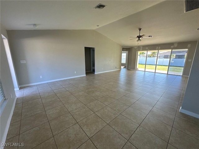 spare room featuring vaulted ceiling, baseboards, visible vents, and ceiling fan