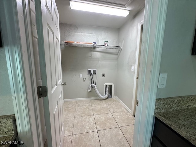 clothes washing area featuring electric dryer hookup, light tile patterned floors, gas dryer hookup, hookup for a washing machine, and laundry area