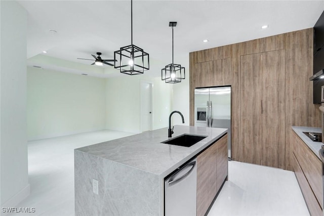 kitchen featuring dishwasher, modern cabinets, and a sink