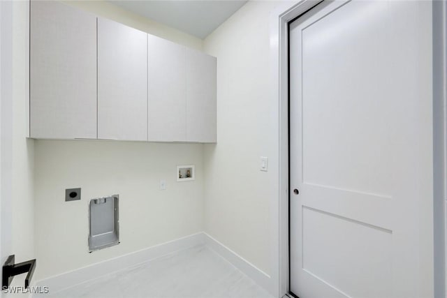 laundry room with cabinet space, hookup for a washing machine, electric dryer hookup, and baseboards