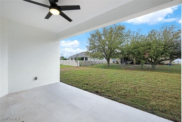 view of patio / terrace with ceiling fan and fence