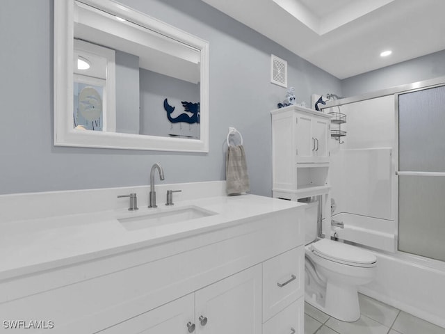 bathroom with visible vents, bath / shower combo with glass door, toilet, tile patterned floors, and vanity