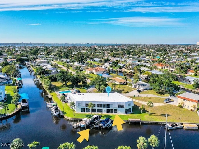 bird's eye view featuring a residential view and a water view