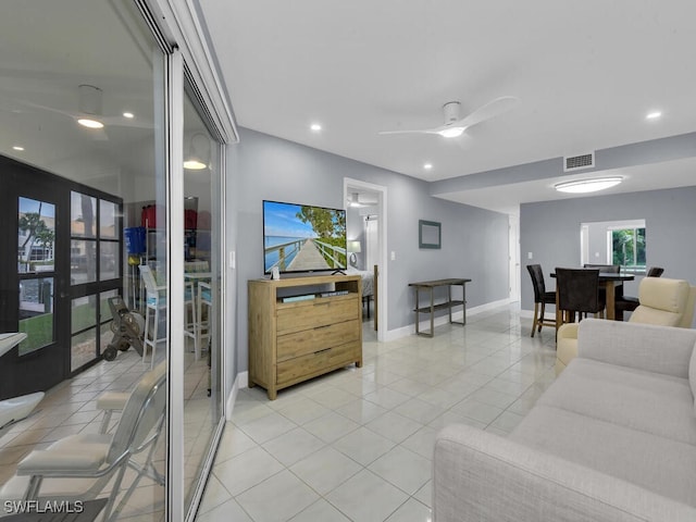 living room with light tile patterned floors, baseboards, visible vents, recessed lighting, and ceiling fan