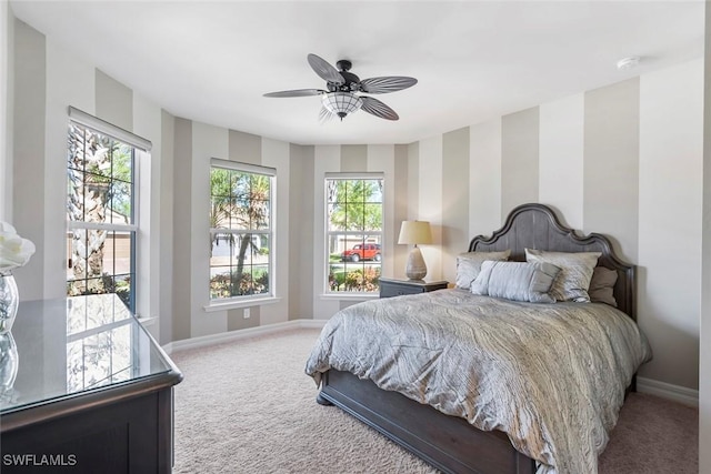 bedroom with carpet flooring, ceiling fan, and baseboards