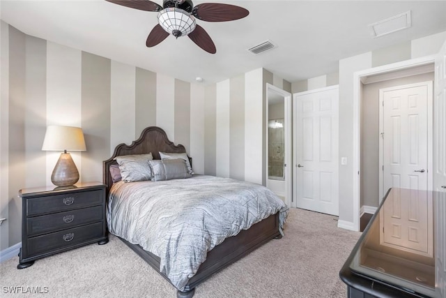 bedroom featuring visible vents, baseboards, light colored carpet, and wallpapered walls