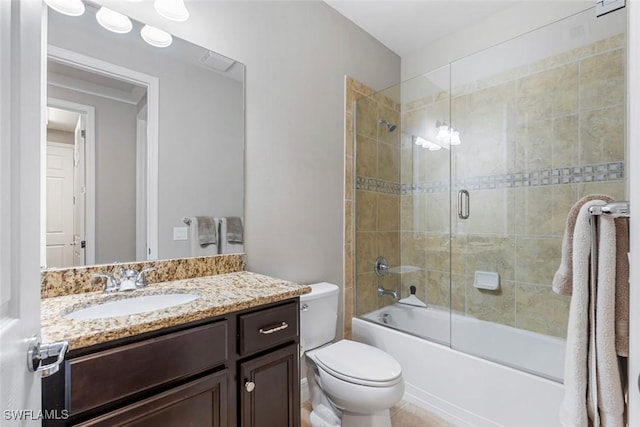 full bathroom with enclosed tub / shower combo, visible vents, toilet, and vanity