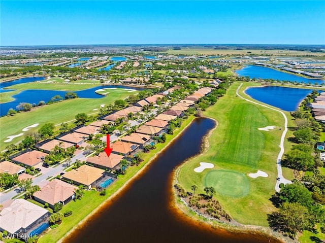 bird's eye view with a residential view, a water view, and golf course view