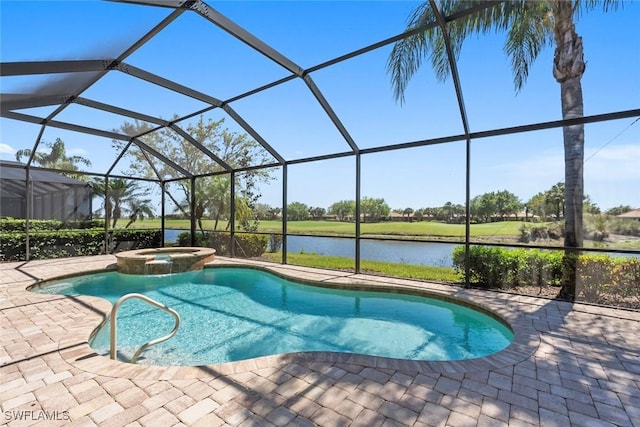 view of pool featuring glass enclosure, a patio area, a water view, and a pool with connected hot tub