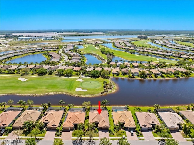 bird's eye view with a residential view, view of golf course, and a water view