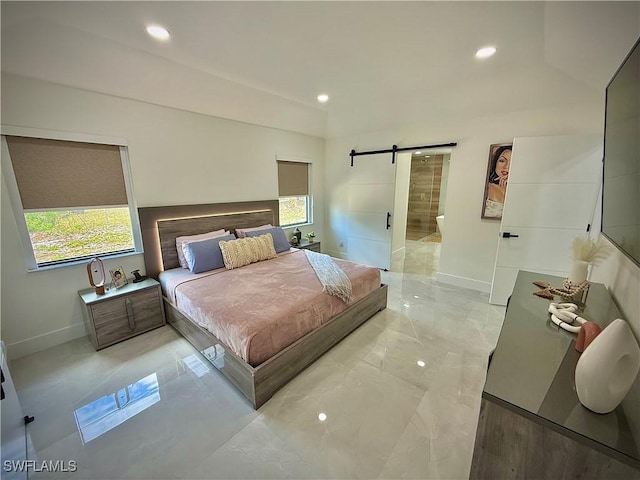 bedroom featuring recessed lighting, baseboards, and a barn door