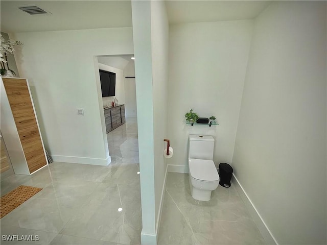 bathroom with visible vents, baseboards, toilet, and marble finish floor