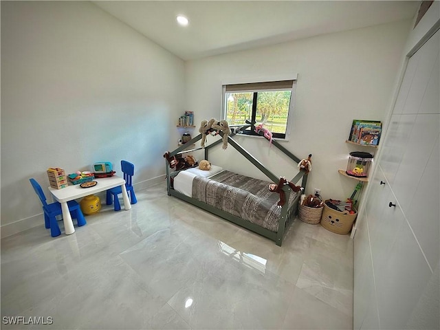 bedroom with recessed lighting and baseboards