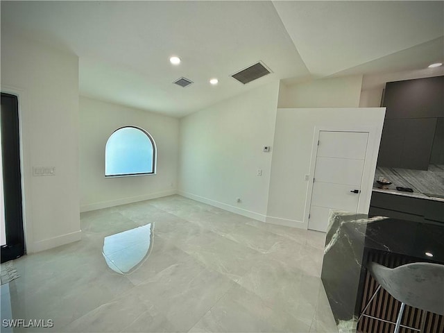 unfurnished room with recessed lighting, baseboards, visible vents, and marble finish floor