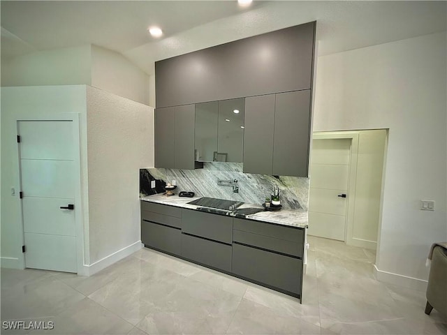bathroom with baseboards, tasteful backsplash, and vanity