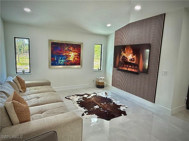 interior space featuring recessed lighting, baseboards, and a healthy amount of sunlight