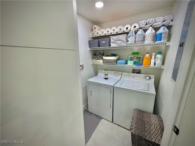 washroom featuring laundry area and washing machine and clothes dryer