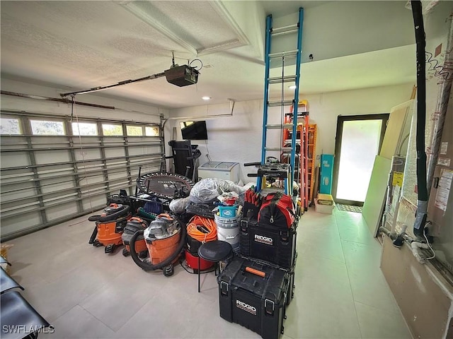 garage featuring a garage door opener