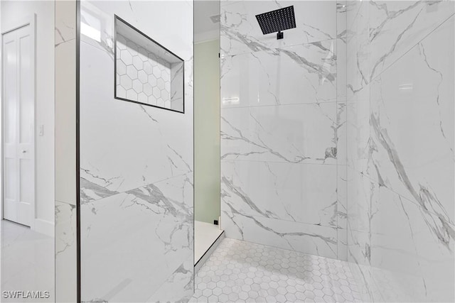 bathroom with a marble finish shower