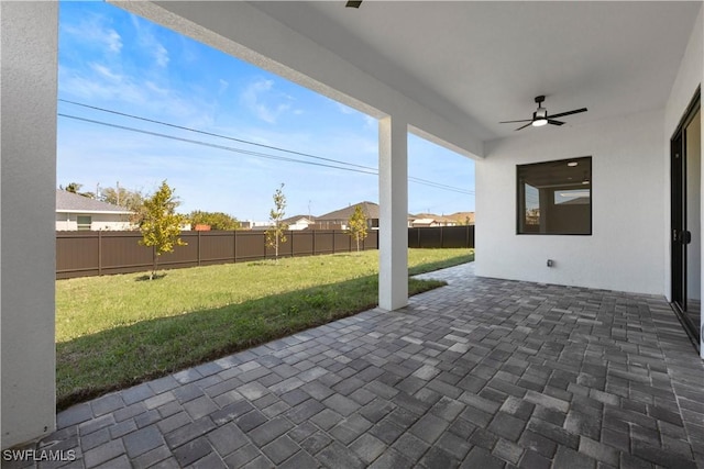 view of patio with a ceiling fan and a fenced backyard