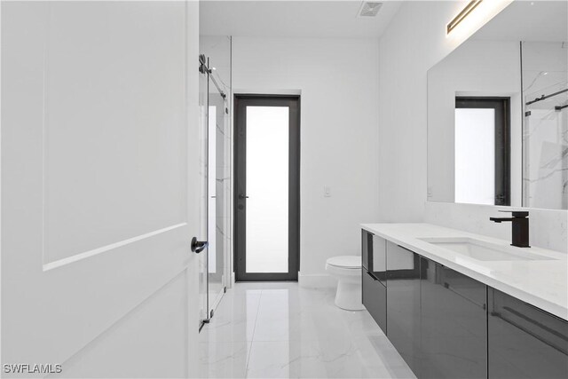 bathroom with visible vents, baseboards, toilet, marble finish floor, and vanity