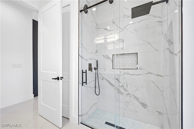 full bathroom featuring marble finish floor, baseboards, and a marble finish shower