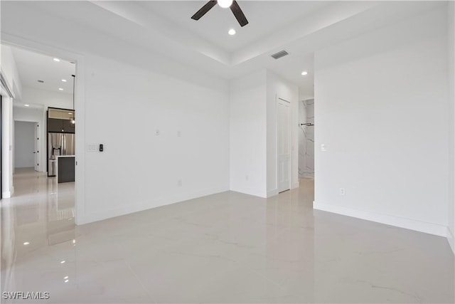 spare room featuring visible vents, baseboards, recessed lighting, marble finish floor, and a ceiling fan