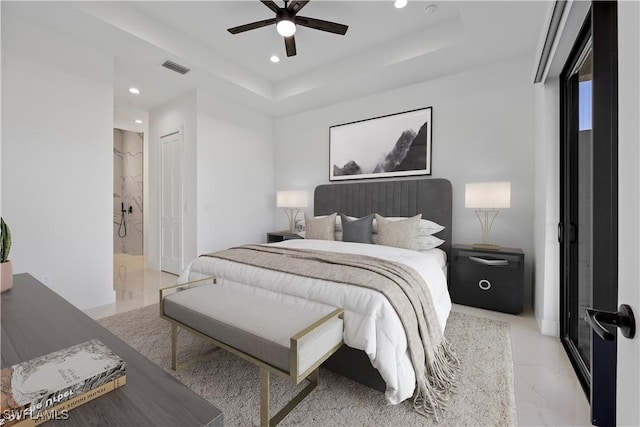 bedroom with a ceiling fan, a tray ceiling, recessed lighting, and visible vents