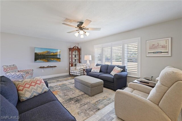 15910 Lake Candlewood Dr Unit 15910, Fort Myers, FL 33907 - living area with visible vents, baseboards, wood finished floors, and a ceiling fan