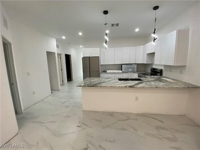 kitchen featuring visible vents, marble finish floor, white cabinetry, stainless steel appliances, and a peninsula