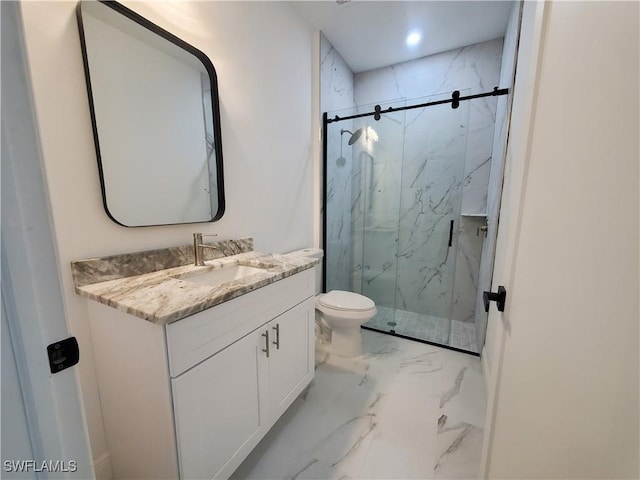 full bath with a marble finish shower, marble finish floor, toilet, and vanity