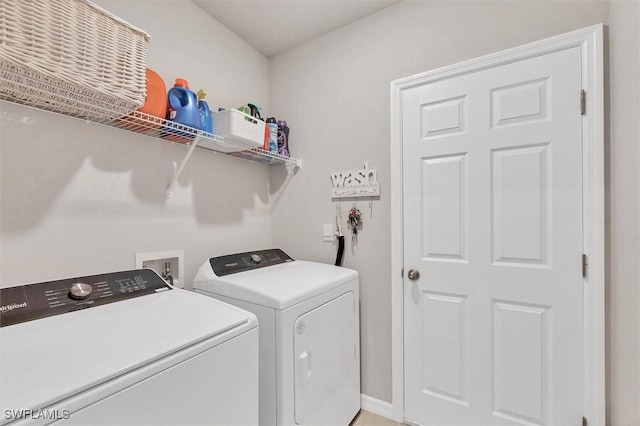 laundry room featuring washing machine and dryer and laundry area