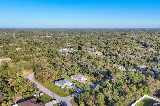 aerial view with a wooded view