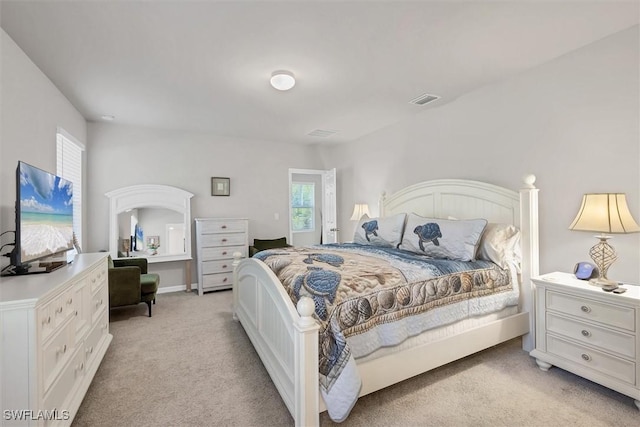 bedroom with light carpet and visible vents