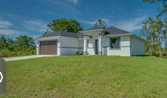 view of front of home with stucco siding, a front yard, concrete driveway, and an attached garage